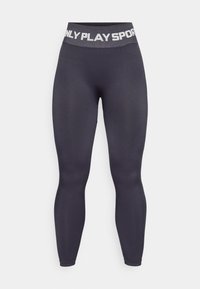 Magasan derekú, sötétszürke leggings rugalmas anyagból, széles derékrésszel, amelyen kontrasztos fehér betűkkel szerepel az "ONLY PLAY SPORT" felirat.