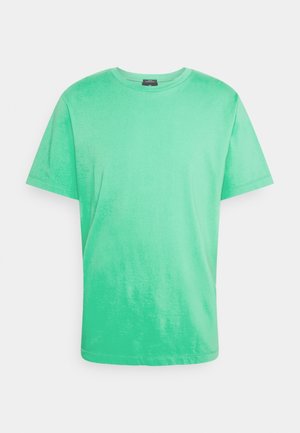 T-shirt semplice a maniche corte con scollo tondo in colore verde brillante uniforme, mostrata su sfondo bianco.