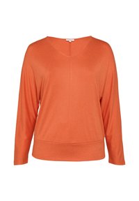 Oranje lange mouw top met een V-hals, relaxte pasvorm en een rechte zoom. Zachte textuur en minimale naden voor een gestroomlijnde uitstraling.