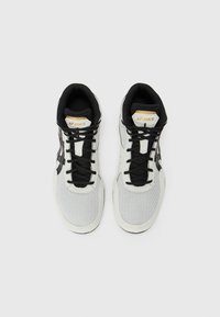 High-top athletic shoes in grey mesh with black accents and laces. Features cushioned collar and signature branding on the tongue.