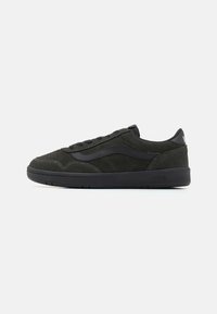 Black suede sneakers with a low profile, featuring a rubber sole, contrasting side stripe, and stitched accents, designed for comfort and style.