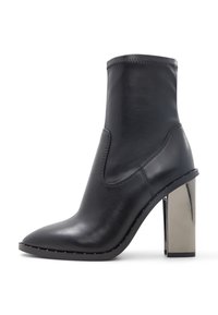Black leather ankle boot with a pointed toe, elastic side, and shiny metallic block heel. Features subtle stitching along the edges.