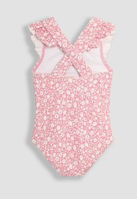 Maillot de bain floral rose avec des motifs blancs, bretelles volantes et un dos croisé. Fabriqué à partir d'un matériau doux et extensible.