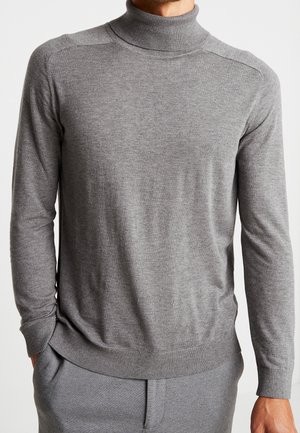 Pull en col roulé gris en tissu tricot doux, avec de longues manches, un col et des poignets côtelés, présentant une coupe ajustée et une texture lisse.