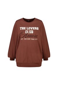 Bruine sweatshirt met witte tekst "THE LOVERS CLUB Amore EST. 1985 NEW YORK CITY." Klassieke ronde hals met losse, ballonmouwen.