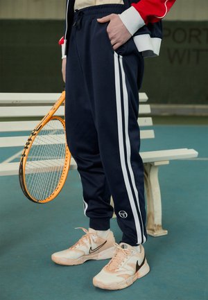 GHIBLI TRACK PANT - Tracksuit bottoms - maritime blue/white