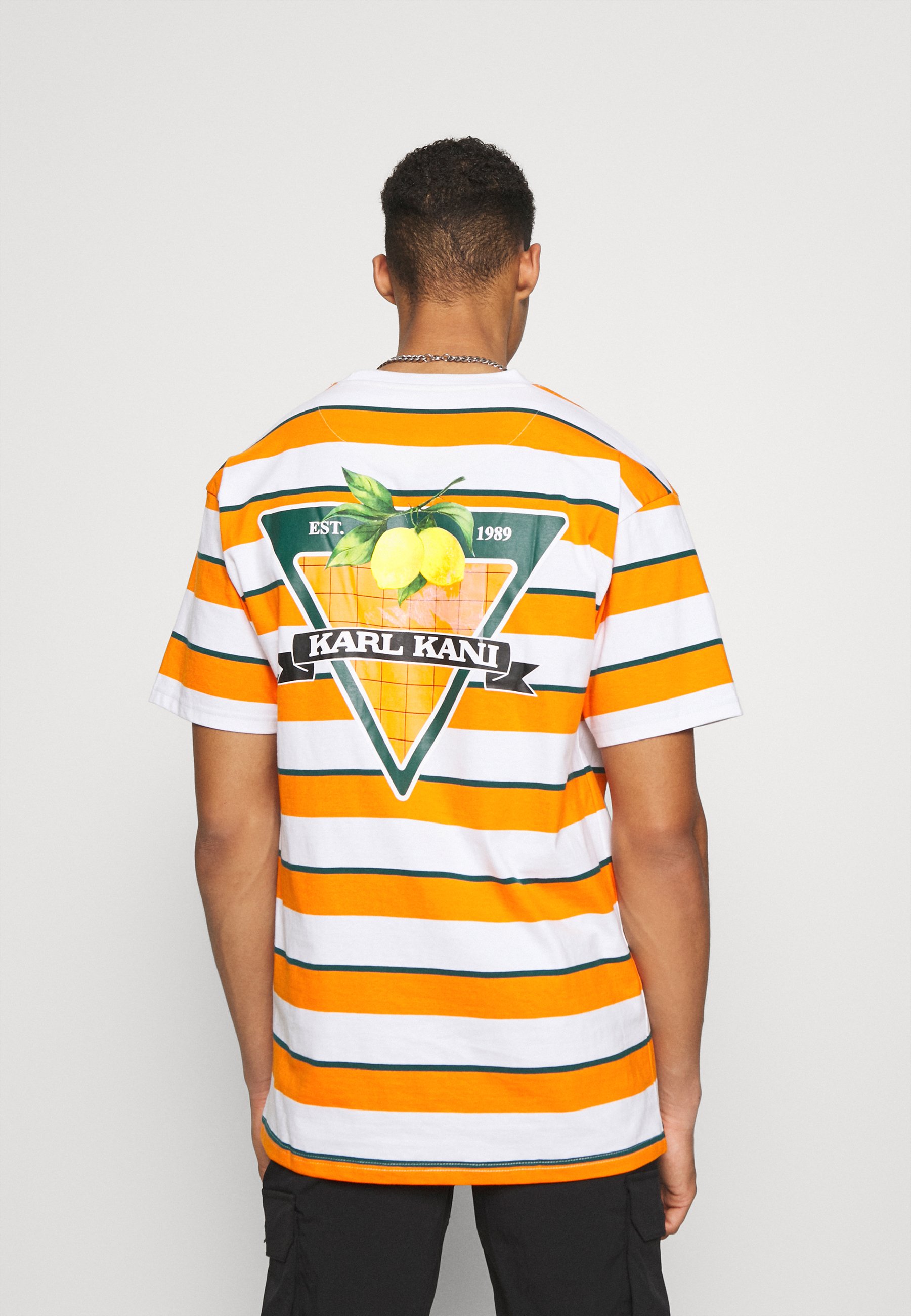Karl Kani SMALL SIGNATURE STRIPE TEE UNISEX - Camiseta estampada -  orange/naranja - Zalando.es