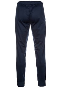 Marineblaue Sporthosen aus glattem, leichtem Stoff. Mit elastischem Bund und eng anliegendem Saum an den Knöcheln.