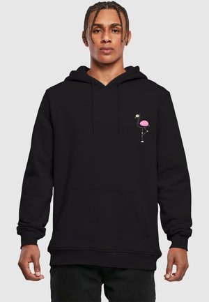 Black hoodie in soft fabric with a kangaroo pocket and drawstring hood; features a pink flamingo graphic on the left chest.