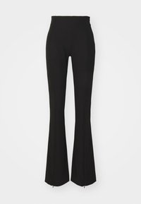 Pantalons noirs taille haute évasés avec une texture lisse, présentant un détail de fermeture éclair à l'ourlet et des coutures ajustées pour un look sculpté.