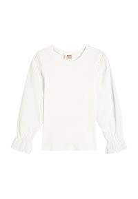 Haut à manches longues blanc avec une texture côtelée et un col rond. Dispose de manches bouffantes avec une bordure en dentelle aux poignets. Matériau léger.