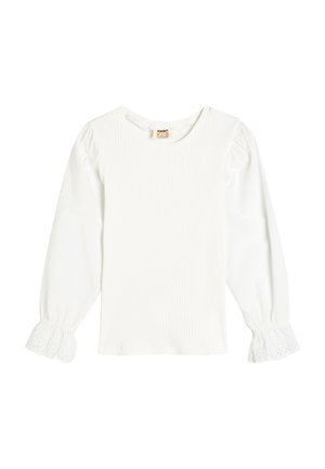 Haut à manches longues blanc avec une texture côtelée et un col rond. Dispose de manches bouffantes avec une bordure en dentelle aux poignets. Matériau léger.
