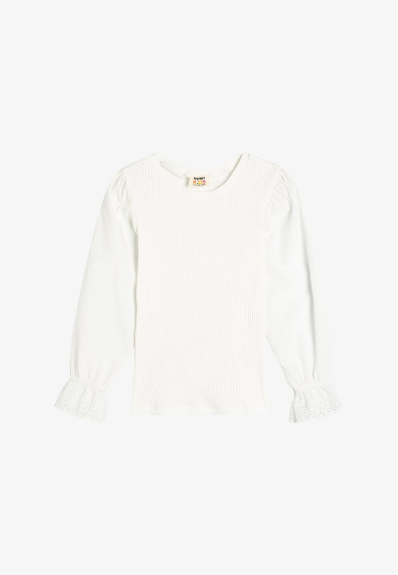 Biała bluzka z długim rękawem o ribbowanej teksturze i okrągłym dekolcie. Posiada bufiaste rękawy z koronkowym wykończeniem na mankietach. Wykonana z lekkiego materiału.