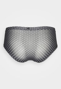 Black mesh boyshorts with white polka dots, featuring a smooth texture and a satin waistband. Compact, seamless design for comfort.