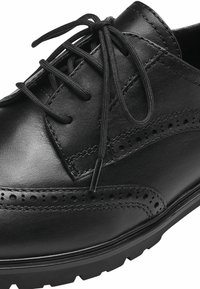 Scarpe eleganti in pelle nera con dettagli perforati, punta rotonda e lacci piatti. Suola in gomma spessa per aderenza e durata.