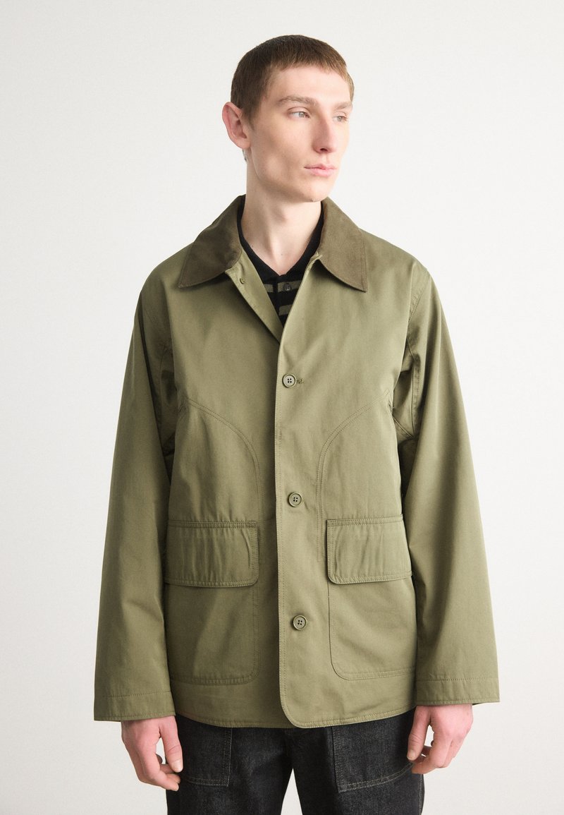 Olive green jacket with a collar, front buttons, and two patch pockets. Features a textured finish and a relaxed fit design.