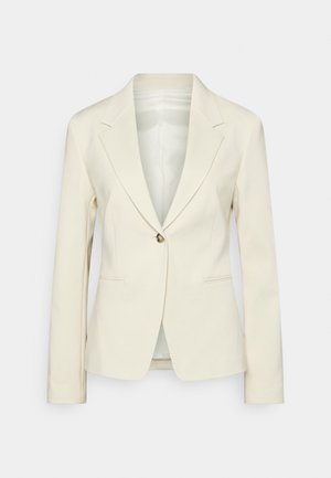 Kremowa, dopasowana marynarka z jednym guzikiem, klapami z wycięciami, długimi rękawami oraz dwoma przednimi kieszeniami z rozcięciami.