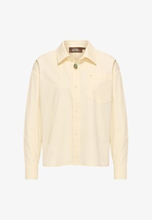 Light yellow long-sleeve shirt made of cotton, featuring a classic collar, front buttons, a chest pocket, and a decorative pin detail.