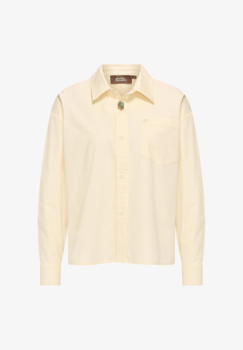 Light yellow long-sleeve shirt made of cotton, featuring a classic collar, front buttons, a chest pocket, and a decorative pin detail.