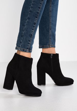 Bottines à talons hauts - black