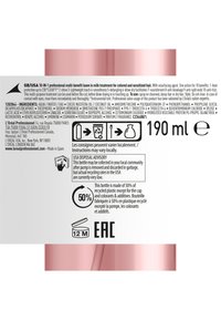 Bouteille de 190 ml de L'Oréal Professionnel, en plastique rose lisse avec une finition métallique, présente du texte blanc et des informations de recyclage sur l'étiquette.
