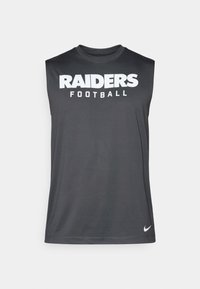 Bezrokavna siva atletska majica iz lahkega materiala, ki ima bel napis "RAIDERS Football". Nike logo v spodnjem desnem kotu.