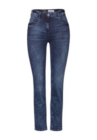 Jean en denim dans un lavage bleu foncé, avec une coupe slim, un design à cinq poches et une fermeture à bouton. Présente un léger délavage pour une texture.