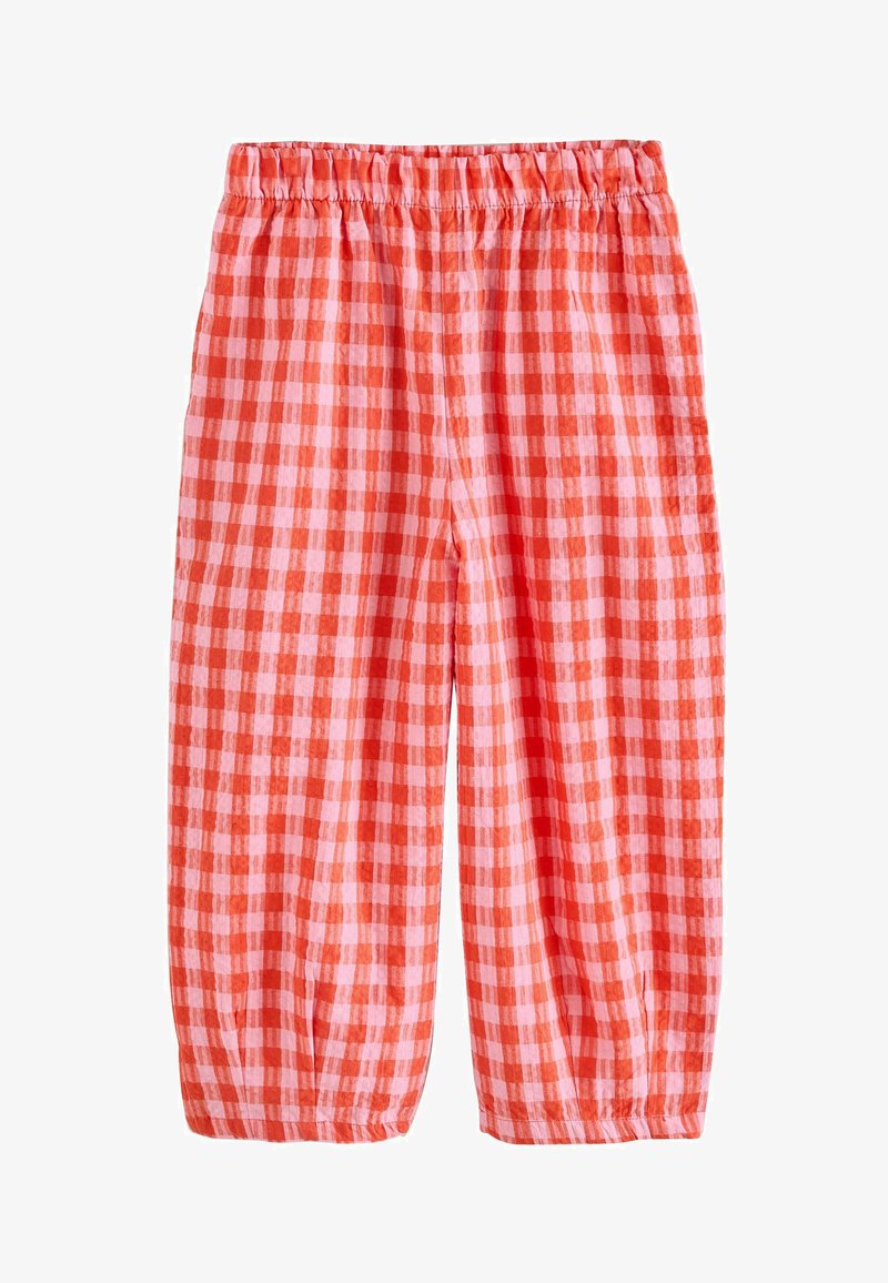 Pantaloni a quadretti rossi e rosa con vita elastica, lunghezza cropped e maniche gatherate all'orlo, realizzati in tessuto leggero.