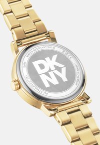 DKNY Montre - gold coloured