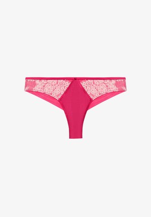 Pink thong brief with a smooth front panel and lace sides. Features a small center bow detail and a seamless design for comfort.