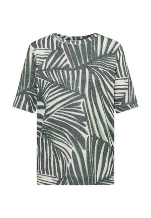 Femme aux cheveux courts bruns portant un haut en tricot à manches courtes avec un motif abstrait de feuilles noires, blanches et vert clair, vue de dos.