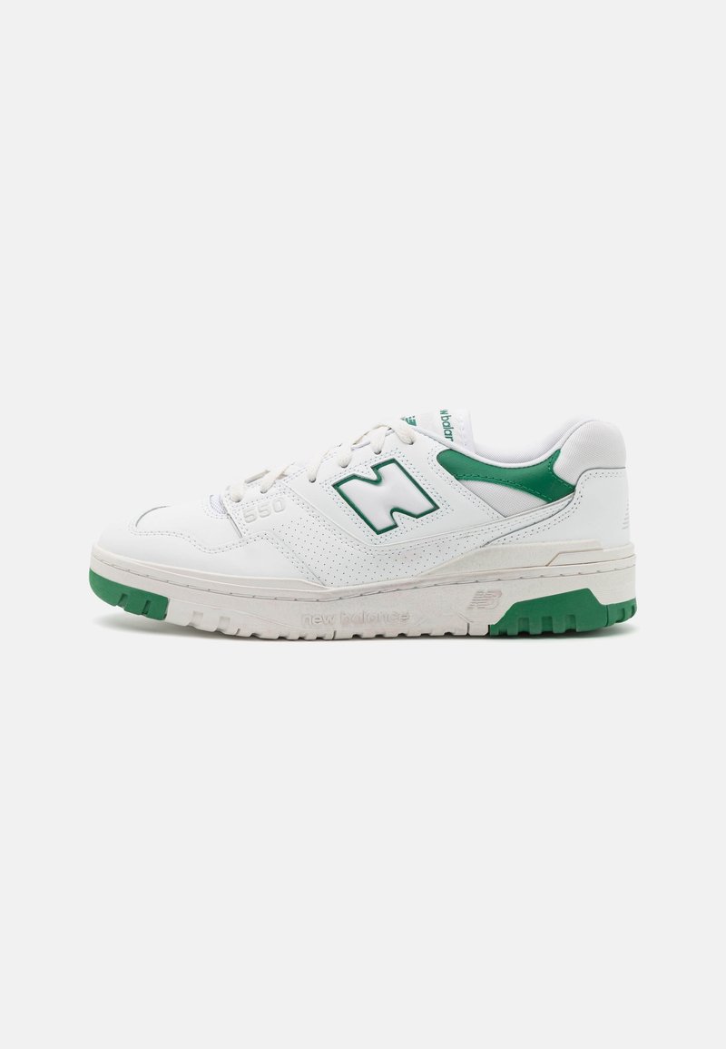 White sneaker with green accents, made of leather and mesh, featuring a perforated design, padded collar, and textured rubber sole.