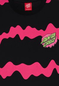 Black t-shirt with pink wavy stripes. Features a green and pink "Santa Cruz Skateboards" logo on the front. Cotton material.