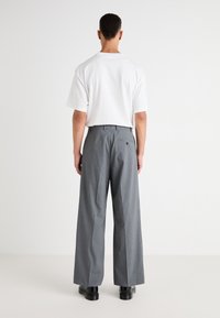 Weekday UNO LOOSE SUIT TROUSERS - Suit trousers - dark grey