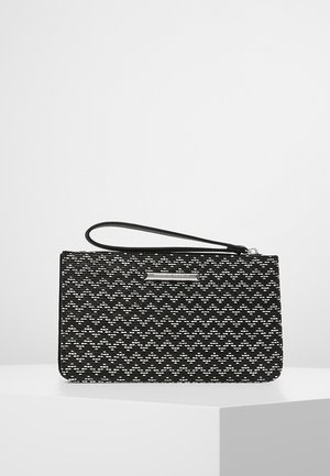 Black and white woven clutch with a wave pattern, featuring a flat rectangular shape, a wrist strap, and a silver accent on the front.