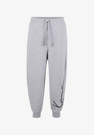 Lysegrå joggingbukser med elastisk linning og manchetter, snøre foran og sort kursivlogo på venstre underben.