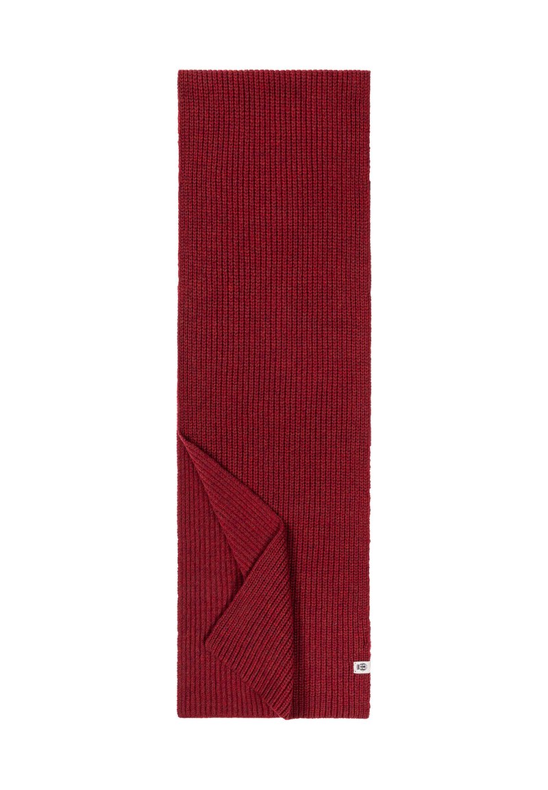 Red knitted scarf with ribbed texture, featuring a folded end. Small label on one corner, machine-knit design.