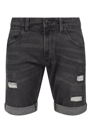 Fekete farmer rövidnadrág, felgörgő szegéllyel, amely koptatott foltokkal és szélszegésekkel díszített. Négy zseb, a deréknál gombos záródással.