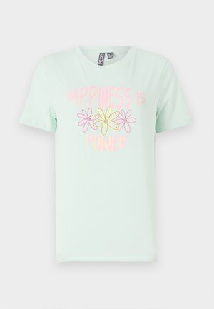 T-shirt de algodão verde menta com mangas curtas, apresentando um design gráfico de flores amarelas e rosas e o texto "A felicidade é poder."
