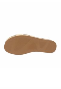 Suola in gomma color nocciola con superficie testurizzata, caratterizzata da una presa a motivo e bordi laterali lisci. Progettata per comfort e stabilità.