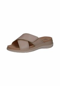 Beige slide sandal with adjustable Velcro strap, cushioned footbed, and a flexible rubber sole. Features cross-over design and smooth texture.