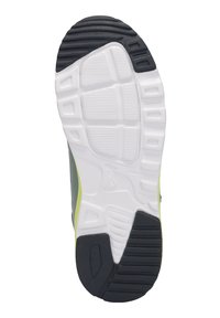 Schwarze Gummisohle mit einem strukturierten Muster, weiße Zwischensohle und ein grüner Akzent an der Seite. Geeignet für Sportschuhe.