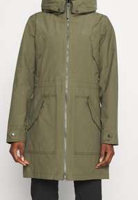 Olive green waterproof parka with a hood, front zipper, two large side pockets, and snap button accents on sleeves. Smooth texture.