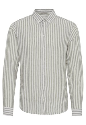 Hosszú ujjú vászoning, váltakozó vékony fehér és világosszürke függőleges csíkokkal. Gombos gallérral és mandzsettával rendelkezik.