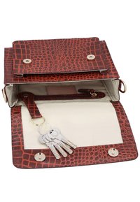 Brown crocodile-patterned leather pouch with a key ring holding six silver keys inside on a beige fabric lining.