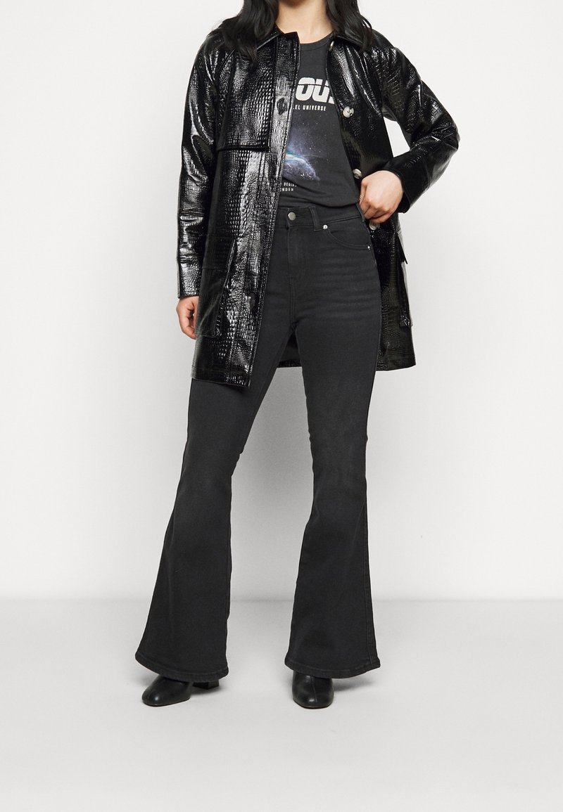 Petite Flared Jeans black (Pre-owned) Zalando