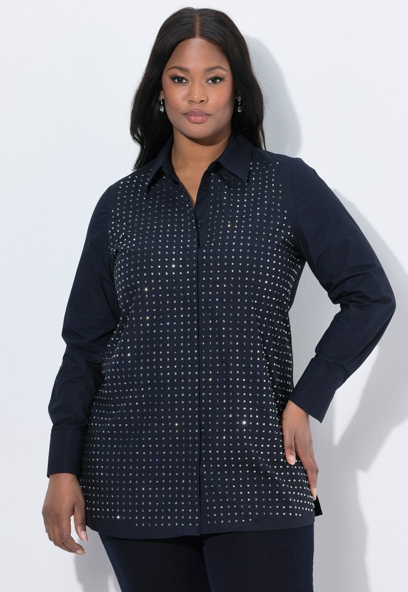 Navy button-up shirt featuring a front design with silver studs arranged in a grid pattern, long sleeves, and a classic collar.