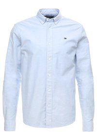 Lichtblauwe button-up shirt gemaakt van katoen; heeft een puntige kraag, lange mouwen en een klein geborduurd logo op de linker borst.