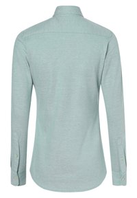 Chemise à manches longues en vert menthe clair, fabriquée en tissu doux. Elle dispose d'un col, de poignets boutonnés et d'un ourlet arrondi.
