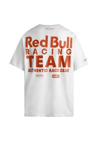White t-shirt featuring large red text reading "Red Bull Racing TEAM" and "AUTHENTIC RACE GEAR" with branding accents on the front and back.